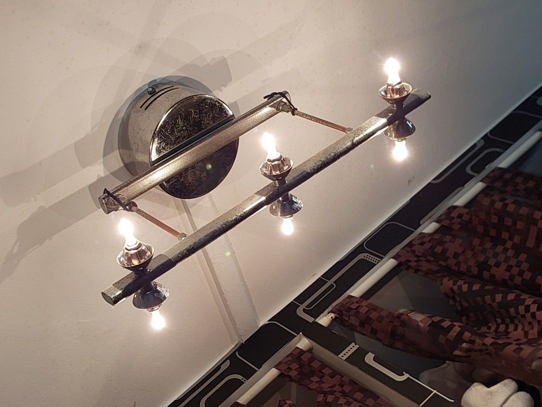 Ceiling light (Category: Lighting) located in Singapore. Submitted by dailylife66 (Listing ID 1453208276, Image 3). Description: - Unique 6-light wall sconce - Chrome and metal finish - Candle-style bulbs included - Adds a vintage vibe - Ideal for hallways or living areas PM for more pictures. I have some bulbs included. Will give out all..