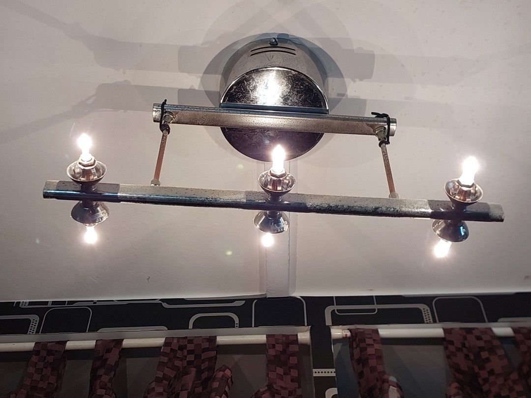 Ceiling light (Category: Lighting) located in Singapore. Submitted by dailylife66 (Listing ID 1453208276, Image 2). Description: - Unique 6-light wall sconce - Chrome and metal finish - Candle-style bulbs included - Adds a vintage vibe - Ideal for hallways or living areas PM for more pictures. I have some bulbs included. Will give out all..