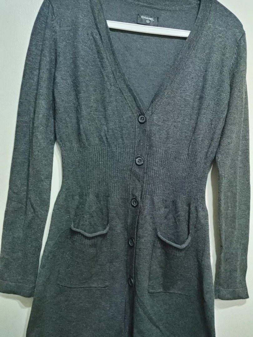 Chanel Grey Button-Up Cardigan (Category: Coats, Jackets and Outerwear) located in Quezon City. Submitted by chph3rd (Listing ID 1453062776, Image 2). Description: - Classic Chanel cardigan in versatile grey. - Long sleeves and V-neckline. - Button-up closure with two front pockets. - Cinched waist for a flattering silhouette. - Ideal for layering over tops or dresses..