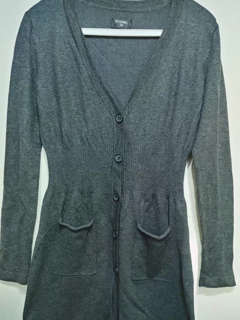 Chanel Grey Button-Up Cardigan (Category: Coats, Jackets and Outerwear) located in Quezon City. Submitted by chph3rd (Listing ID 1453062776, Image 1). Description: - Classic Chanel cardigan in versatile grey. - Long sleeves and V-neckline. - Button-up closure with two front pockets. - Cinched waist for a flattering silhouette. - Ideal for layering over tops or dresses..