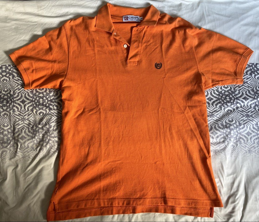 Chaps Orange Polo Shirt Men's Size M (Category: Tshirts & Polo Shirts ) located in Pila. Submitted by llard (Listing ID 1453078625, Image 2). Description: - Orange Chaps polo shirt - unnoticeable tear Medium on Tag Dimes: 66cm length 50cm width slight nego .