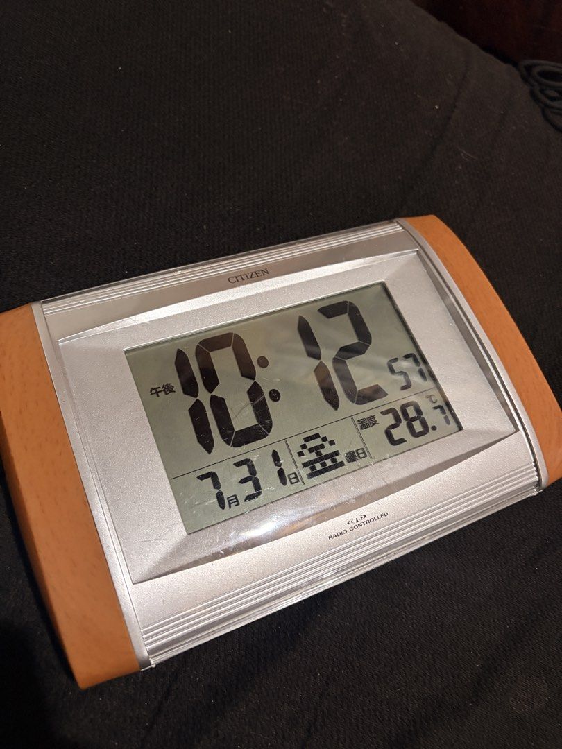 Citizen Radio Controlled Digital Clock (Category: Clocks) located in Cavite. Submitted by marxvenn (Listing ID 1453148435, Image 2). Description: - Citizen digital clock - Displays time, date, day, and temperature - Wooden accents trim on sides - In good working condition w/ minor scratches Loc: Dasma Cavite.