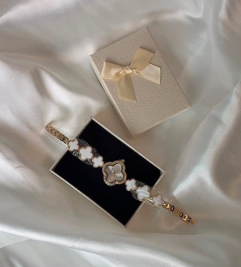Clover Charm Watch - Black or White (Category: Women's Watches) located in Manila. Submitted by thearchive22 (Listing ID 1453112979, Image 3). Description: - Cute watch with adorable clover charms - Available in black or white stone options - Stylish gold-tone metal strap - Comes beautifully packaged in a gift box - Ideal for everyday wear or as a thoughtful gift - Please specify your preferred color (black or white) upon purchase!.