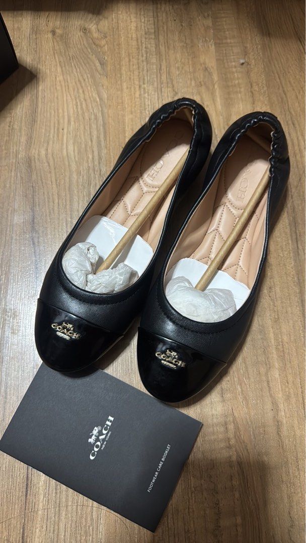 Coach Black Patent Cap Toe Ballet Flats (Category: Flats & Sandals) located in Makati City. Submitted by authenticstuffff (Listing ID 1453199178, Image 1). Description: - Classic black Coach ballet flats - Features a patent cap toe with signature Coach logo - Elasticated topline for a secure and comfortable fit - Comes with original footwear care booklet - Versatile for everyday wear or dressing up.