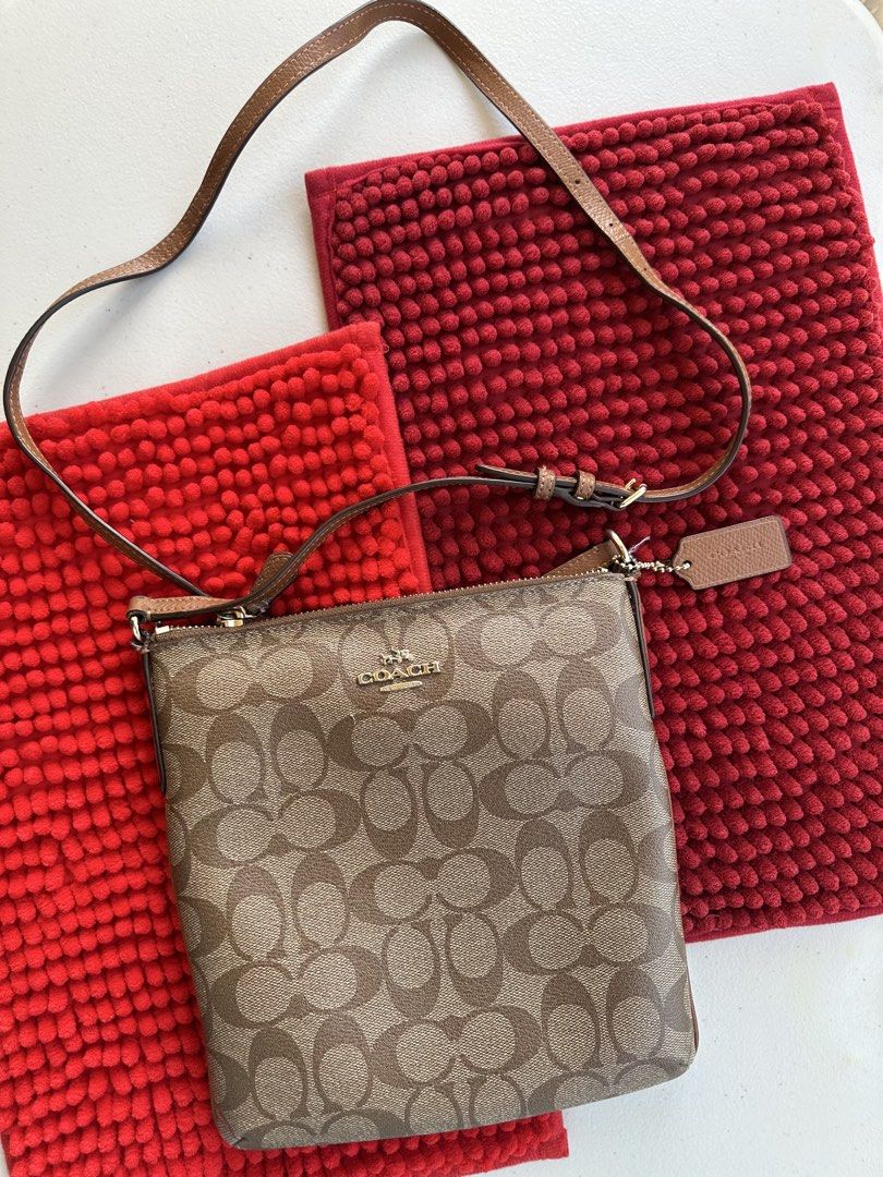 Coach Signature Monogram Crossbody Bag (Category: Luxury Bags & Wallets) located in San Fernando. Submitted by golden_pat.d (Listing ID 1453216599, Image 1). Description: 🔸Authentic Coach crossbody bag 🔸Classic brown and tan monogram pattern 🔸Genuine leather strap and tag 🔸Secure zipper closure 💰Price is negotiable 📍 San Fernando, Pampanga / Monumento, Caloocan ‼️RFS: Decluttering‼️ .