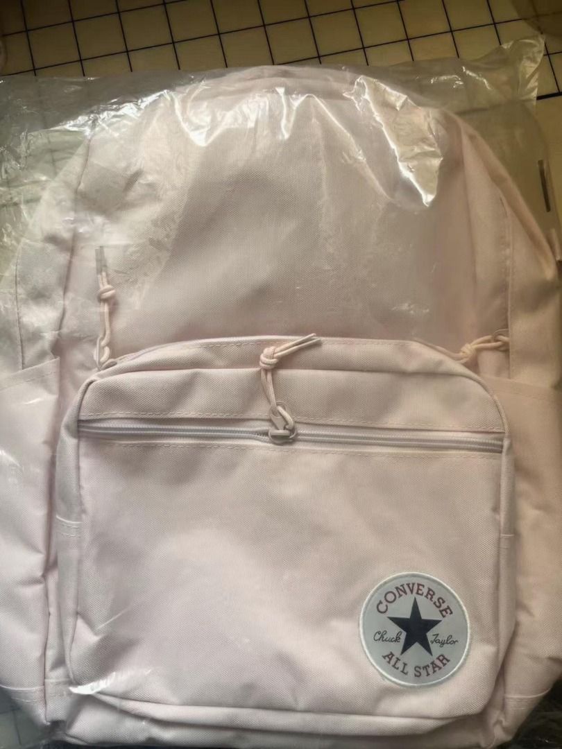 Converse backpack (Category: Diaper Bags & Wetbags) located in Singapore. Submitted by bonehumb118 (Listing ID 1453074147, Image 1). Description: - Brand new Converse backpack - Color: Light Pink - Features iconic Chuck Taylor All Star logo - Zippered front pocket for secure storage - Ideal for school, work, or everyday carry - Comes in original packaging.