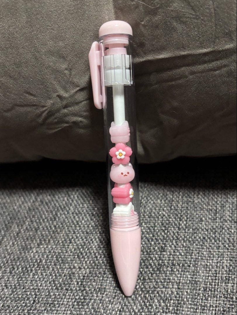 Cute Pink Gel Pen with Charms Inside (Category: Stationery & School Supplies) located in Naga. Submitted by myroomarchive (Listing ID 1453066010, Image 1). Description: - Adorable pink gel pen - Features cute flower and bunny charms inside the barrel - Writes smoothly in black ink - Ideal for journaling, note-taking, or as a fun accessory.