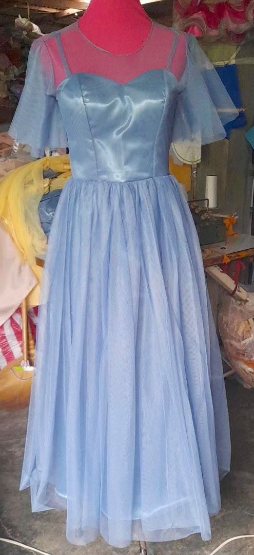 Dusty Blue Bridesmaid Gown (Category: Evening dresses & gowns) located in Bulacan. Submitted by makristeenkoleen (Listing ID 1452805476, Image 2). Description: - Dusty Blue color - With free clutch bag (shown in the photo) - Ideal for formal events, weddings, photoshoots - Comfortable and flowy design.