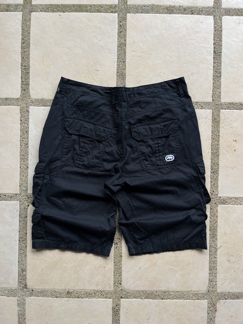 Ecko Unltd. Black Cargo Shorts Size 36 (Category: Shorts) located in Cavite. Submitted by the_retrorevivalph (Listing ID 1453212090, Image 1). Description: - Brand: Ecko Unltd. - Color: Black - Style: Cargo Shorts - Size: 36 waist - Features: Multiple front and back pockets, button and zip closure - Ideal for: Casual wear.