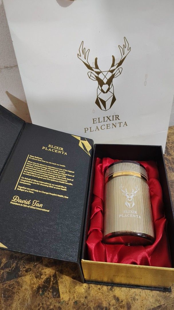 Elixir Placenta 1000mg Softgel Food Supplement (Category: Health Food, Drinks & Tonics) located in Pasig City. Submitted by ghejoy_26 (Listing ID 1453064061, Image 3). Description: - Elixir Placenta Food Supplement - 60 softgels per bottle - 1000mg per softgel - Net weight: 60g - Premium gold bottle and black box packaging - Includes a gift bag - No approved therapeutic claims - 1 lang ang nabawas -bought last April, 2026 hindi na nainom ibang ca