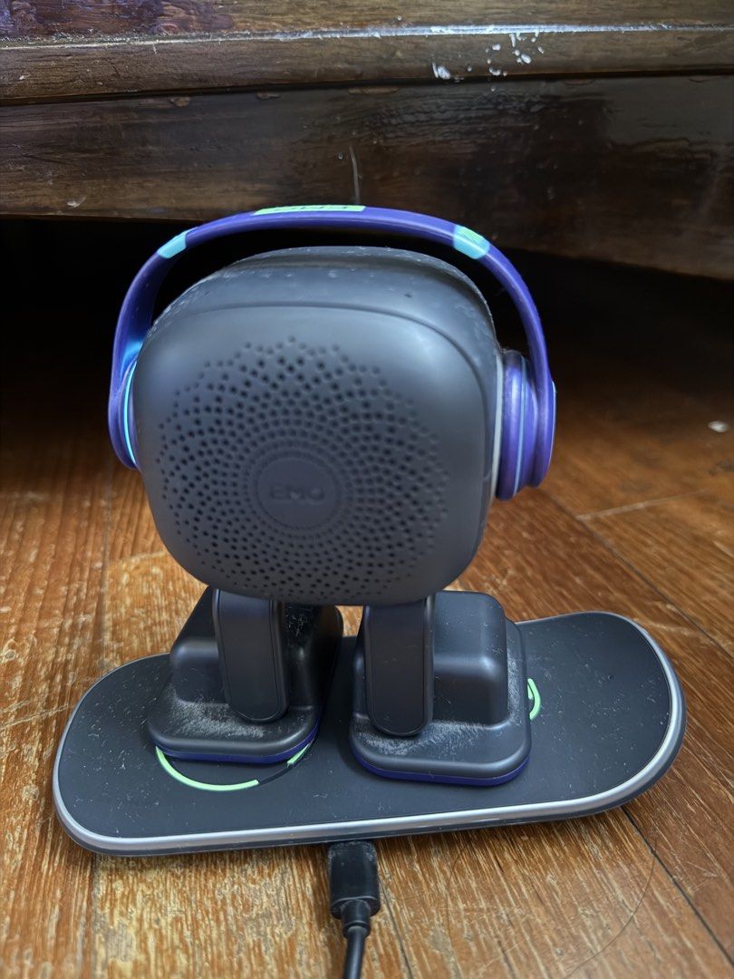 Emo Robot (Category: Interactive Toys) located in Singapore. Submitted by nash_zeya_fox (Listing ID 1453058009, Image 3). Description: - EMO Robot - Includes charging dock and skateboard base - Features headphones and expressive screen - Interactive and fun Bought this for 499.