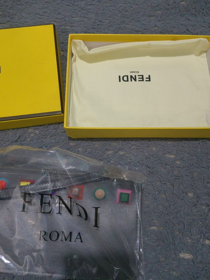 Fendi Roma Pouch with Studs (Category: Luxury Bags & Wallets) located in Las Pinas. Submitted by huslerz (Listing ID 1453112167, Image 2). Description: - Grey Fendi Pouch - Made in Italy - Features colorful stud embellishments - Secure zip closure - Comes with original box and dust bag - Ideal for organizing daily essentials.