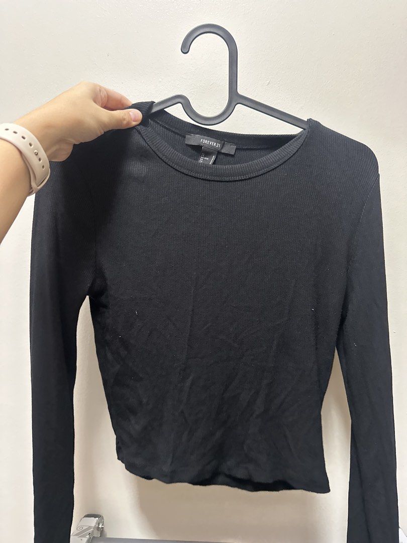 Forever 21 Black Ribbed Long Sleeve Top (Category: Longsleeves) located in Mandaluyong City. Submitted by danee. (Listing ID 1453133160, Image 1). Description: - Basic black long-sleeved top - Brand: Forever 21 - Features: Ribbed texture, crew neck - Versatile: Great for layering or wearing on its own - Style: Easy to pair with any outfit.