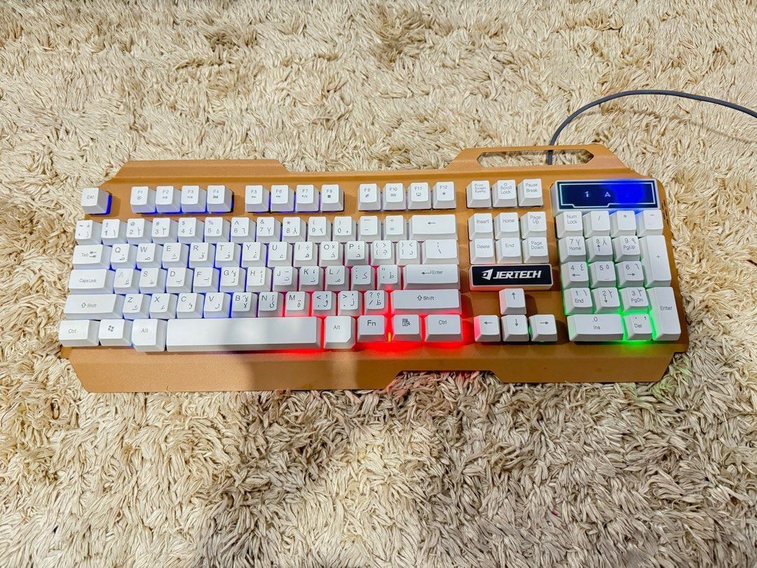 Gaming Keyboard Jertech (Category: Mouse & Mousepads) located in Manila. Submitted by affordshopz (Listing ID 1453158453, Image 2). Description: This keyboard features a unique, angular ergonomic frame that provides great wrist support for long typing or gaming sessions. It has been thoroughly tested, cleaned, and is ready for its next owner. Key Features: Dual Layout: Features standard English QWERTY letters alongside printed Korean (Hangul) cha