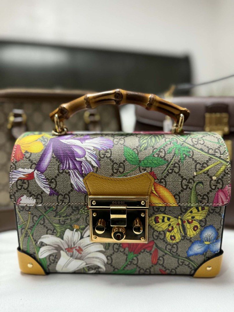 Gucci GG Supreme Monogram Flora Small Padlock Bamboo Ba (Category: Luxury Bags & Wallets) located in Antipolo. Submitted by safeowl_09a32c (Listing ID 1453055244, Image 1). Description: PhP 68000 PRE-OWNED Brand: GUCCI Measures: 9″ L x 6.5″ H x 3.5″ D (approx) 1.5″ Handle Drop 21″ Strap Drop, adjustable Material: Multicolor GG Coated Canvas with Yellow Leather Trim Floral and Butterfly Details Brown Microfiber Lining Flap Top with Press-Lock Padl