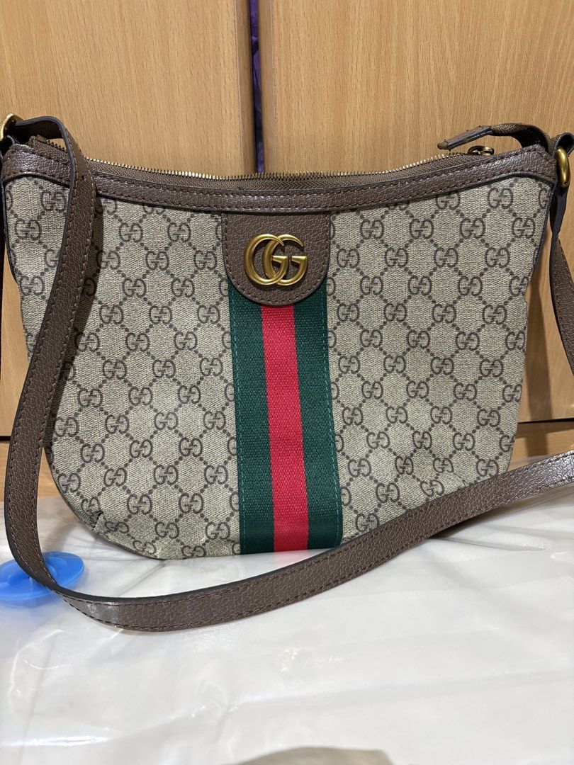 Gucci Monogram Shoulder Bag with Green and Red Stripe (Category: Luxury Bags & Wallets) located in Pateros City. Submitted by fatkat109 (Listing ID 1453085894, Image 1). Description: - Classic Gucci monogram shoulder bag - Iconic GG logo - Signature green and red stripe - Leather trim and strap - Zipper closure - Gold-tone hardware - Timeless addition to your collection Issues: - faint stain on the interior, near zipper.