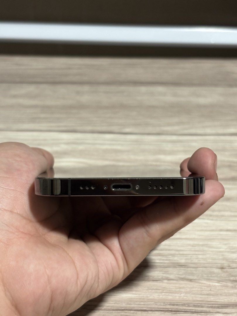 Iphone 12 Pro - Graphite (Category: iPhone 12 Series) located in Kawit. Submitted by iblameandrxw (Listing ID 1453155859, Image 3). Description: iPhone 12 Pro - Graphite (128GB) Details: * Battery Health: 98% * ✅ True Tone Working * ✅ Face ID Working * Includes Unit + Case Only ⚠️ Issues (Honest Disclosure): * Occasional ghost touch (when it overheats, top part, not always present) * Minor scratches (barely noticeable) PM if interested or for mor