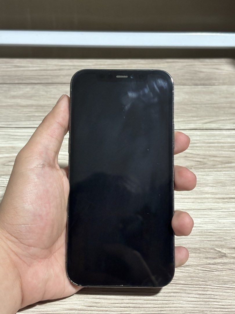 Iphone 12 Pro - Graphite (Category: iPhone 12 Series) located in Kawit. Submitted by iblameandrxw (Listing ID 1453155859, Image 2). Description: iPhone 12 Pro - Graphite (128GB) Details: * Battery Health: 98% * ✅ True Tone Working * ✅ Face ID Working * Includes Unit + Case Only ⚠️ Issues (Honest Disclosure): * Occasional ghost touch (when it overheats, top part, not always present) * Minor scratches (barely noticeable) PM if interested or for mor
