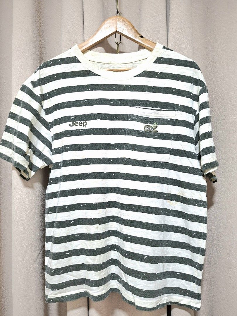 Jeep Striped Pocket T-Shirt (Category: Tshirts & Polo Shirts ) located in Batangas. Submitted by sell_ph (Listing ID 1453051245, Image 1). Description: - Authentic Jeep striped t-shirt - Features a chest pocket with embroidered Jeep logo - Jeep logo also printed on the front - Shows some light discoloration, particularly on the white stripes - Perfect for everyday casual wear.