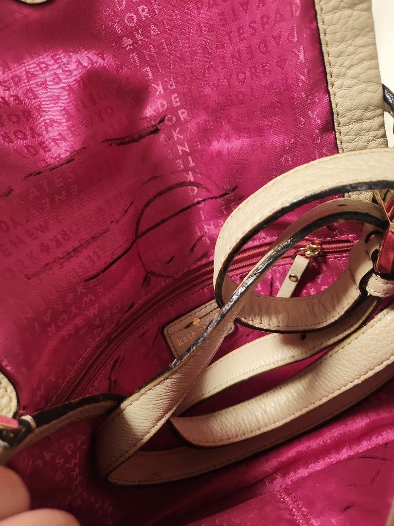 Kate Spade Beige Leather Handbag with Pink Interior (Category: Luxury Bags & Wallets) located in Valenzuela. Submitted by jochaaa011 (Listing ID 1453201269, Image 3). Description: - Brand: Kate Spade - Color: Beige exterior, bright pink interior with signature print - Material: Genuine Leather - Closure: Zipper - Condition: Exterior leather shows some wear, particularly on straps. Interior lining has marks and scuffs. - Style: Perfect for everyda