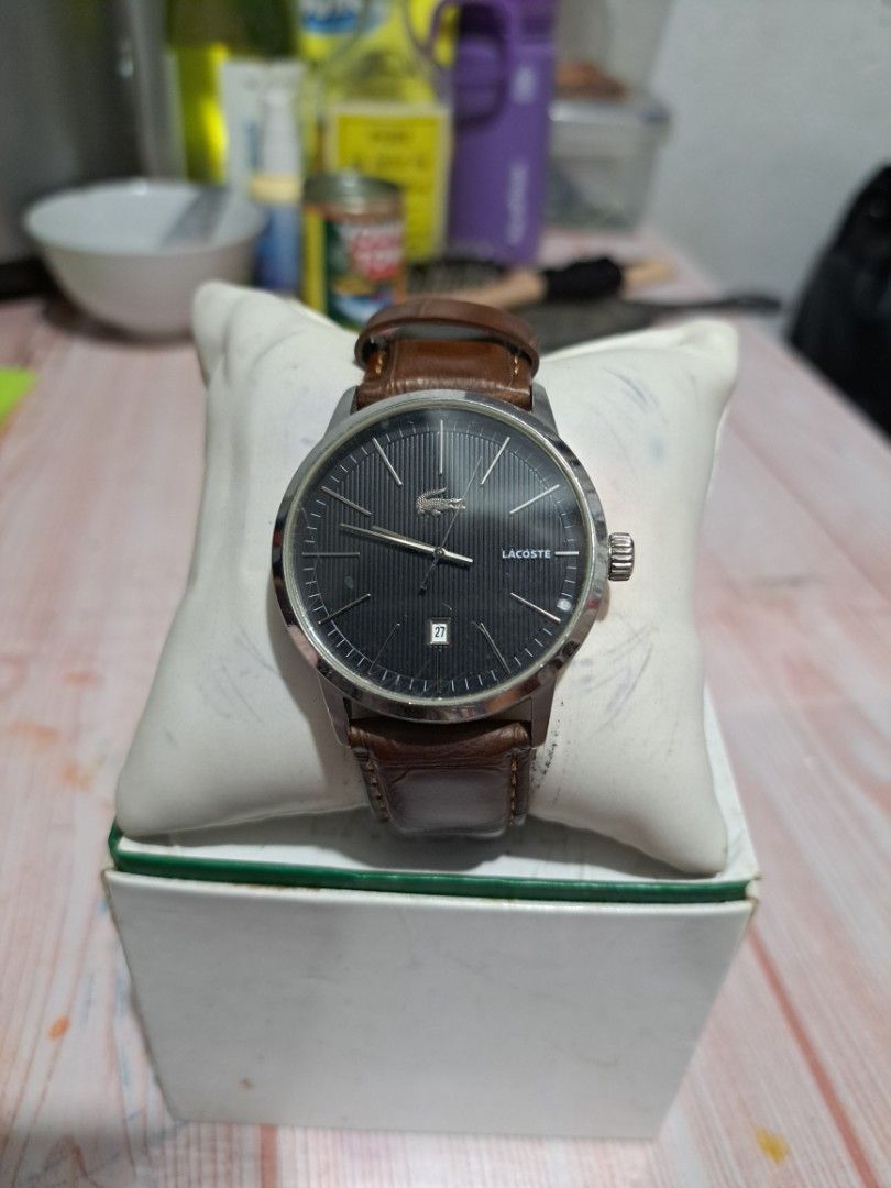 Lacoste Men's Watch Brown Leather Strap (Category: Men's Watches) located in Makati City. Submitted by lokaltisoy.1274 (Listing ID 1453195248, Image 1). Description: - Authentic Lacoste Watch - Model: LC 35.1.14.0173 - Dial: Dark Grey with Date Window - Strap: Genuine Brown Italian Leather (Replacement) - Case: Stainless Steel - Includes Original Lacoste Box.