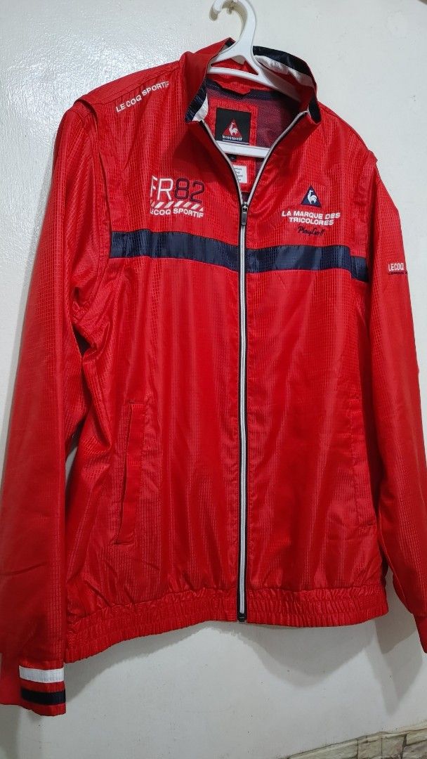 LE COQ SPORTIF Golf 2-Way Zip Jacket Red (Category: Coats, Jackets and Outerwear) located in Quezon City. Submitted by chph3rd (Listing ID 1453063368, Image 2). Description: -bought in Japan. detachable sleeves. Red Le Coq Sportif golf jacket - Features "LA MARQUE DES TRICOLORES" and "FR82" graphics - Zip-up front with a stand-up collar - Long sleeves with elasticated cuffs and hem - Ideal for golf or casual wear.