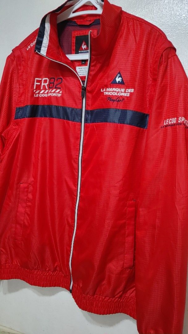 LE COQ SPORTIF Golf 2-Way Zip Jacket Red (Category: Coats, Jackets and Outerwear) located in Quezon City. Submitted by chph3rd (Listing ID 1453063368, Image 3). Description: -bought in Japan. detachable sleeves. Red Le Coq Sportif golf jacket - Features "LA MARQUE DES TRICOLORES" and "FR82" graphics - Zip-up front with a stand-up collar - Long sleeves with elasticated cuffs and hem - Ideal for golf or casual wear.