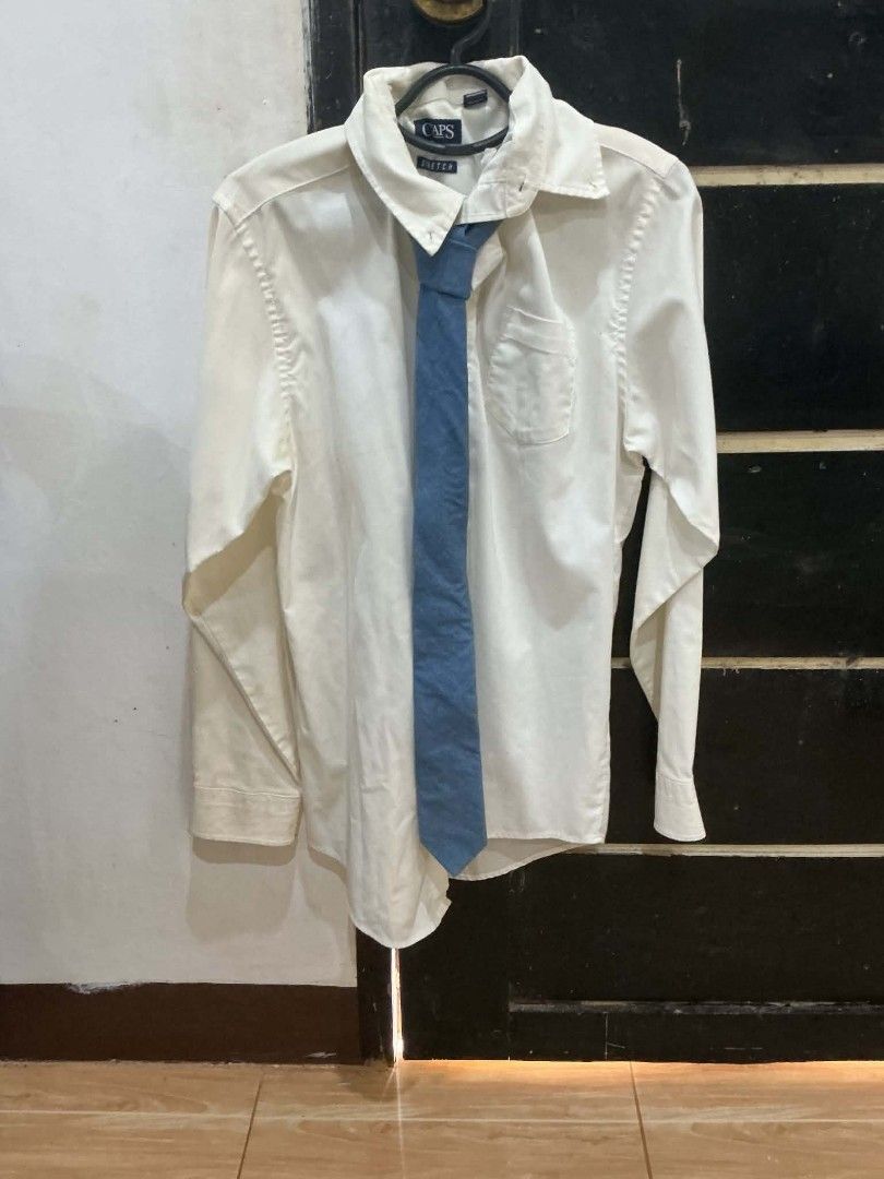 Light Blue Denim Tie (Category: Tshirts & Polo Shirts ) located in Bautista. Submitted by the.clutter__ (Listing ID 1453092344, Image 1). Description: - Classic collared style - Versatile for formal or casual wear - Features a chest pocket - Ready to wear Add 75 if button down is included.