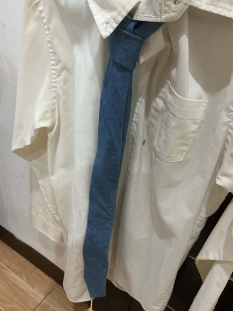 Light Blue Denim Tie (Category: Tshirts & Polo Shirts ) located in Bautista. Submitted by the.clutter__ (Listing ID 1453092344, Image 2). Description: - Classic collared style - Versatile for formal or casual wear - Features a chest pocket - Ready to wear Add 75 if button down is included.