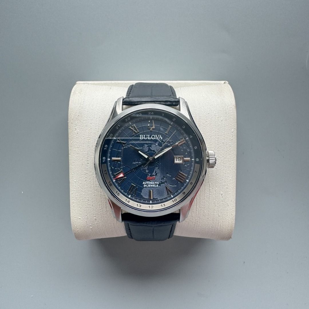 LNIB Bulova "Classic Wilton GMT" Automatic Watch (Category: Men's Watches) located in Manila. Submitted by twlph (Listing ID 1453055702, Image 1). Description: LNIB Bulova "Classic Wilton GMT" Automatic Watch - Can be rated 9.5/10, in very good condition. - Complete set. - 43mm case diameter. - Sapphire crystal. - Stainless steel case. - Black leather strap. - Blue dial with textured world map design. - 30m water resistance. - Caliber 9075 Japane