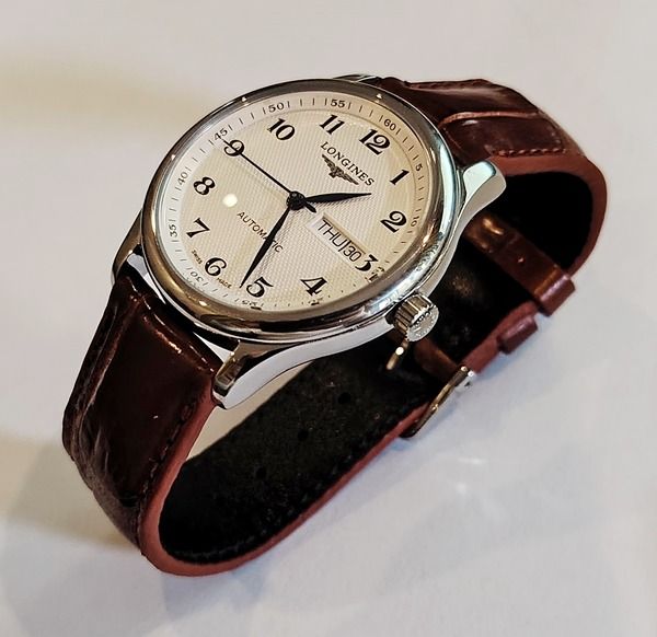 Longines Master Collection Day Date (Category: Luxury Watches) located in Baguio. Submitted by waistcoatgems (Listing ID 1439176827, Image 2). Description: Stunning Master Collection Day Date with Genuine Swiss Eta2836-2 movement. Fully serviced and working as it should. "Not Made By Longines" 39.5mm diameter with Genuine Alligator Strap. Watch is in Baguio City and shipping is included. Payment by Bank Transfer of PayPal..