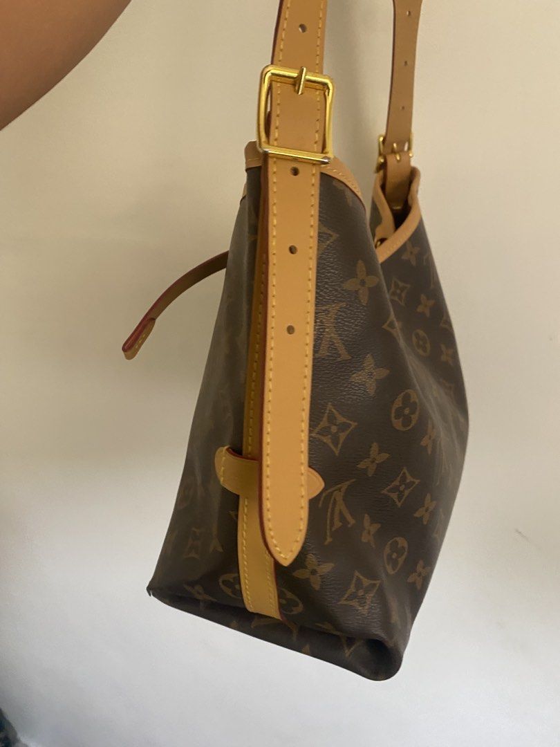 Louis Vuitton Monogram Canvas Shoulder Bag (Category: Luxury Bags & Wallets) located in Paete. Submitted by ladder_leynn (Listing ID 1453096523, Image 3). Description: -AUTHENTICITY NOT GUARANTEED - Classic Louis Vuitton shoulder bag in iconic Monogram canvas. - Features tan leather trim and straps. - Adjustable strap with gold buckle for a customized fit. - Secure drawstring closure. - Includes a detachable leather luggage tag with LV logo. - Li