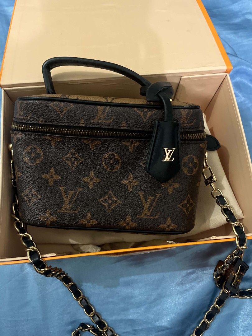 Louis Vuitton Monogram Vanity Case Bag (Category: Luxury Bags & Wallets) located in Manila. Submitted by kayd86043 (Listing ID 1453109871, Image 1). Description: - Classic Louis Vuitton monogram vanity case - Features a top handle - Detachable chain strap included - Comes with original box, dust bag, and lock - Secure zipper closure - Ideal for travel or everyday use.
