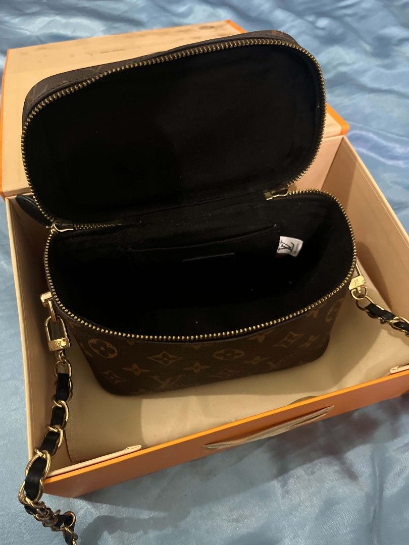 Louis Vuitton Monogram Vanity Case Bag (Category: Luxury Bags & Wallets) located in Manila. Submitted by kayd86043 (Listing ID 1453109871, Image 3). Description: - Classic Louis Vuitton monogram vanity case - Features a top handle - Detachable chain strap included - Comes with original box, dust bag, and lock - Secure zipper closure - Ideal for travel or everyday use.