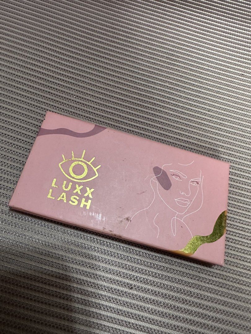 LUXX LASH Magnetic Lashes - Lily (Category: Makeup) located in Dasmarinas. Submitted by maecybee (Listing ID 1453128692, Image 1). Description: - Brand: LUXX LASH - Style: Lily - Includes: Left and right lash pieces - Packaging: Pink case with built-in mirror - Features: Easy to apply, reusable - Benefits: Adds volume and length to your look.