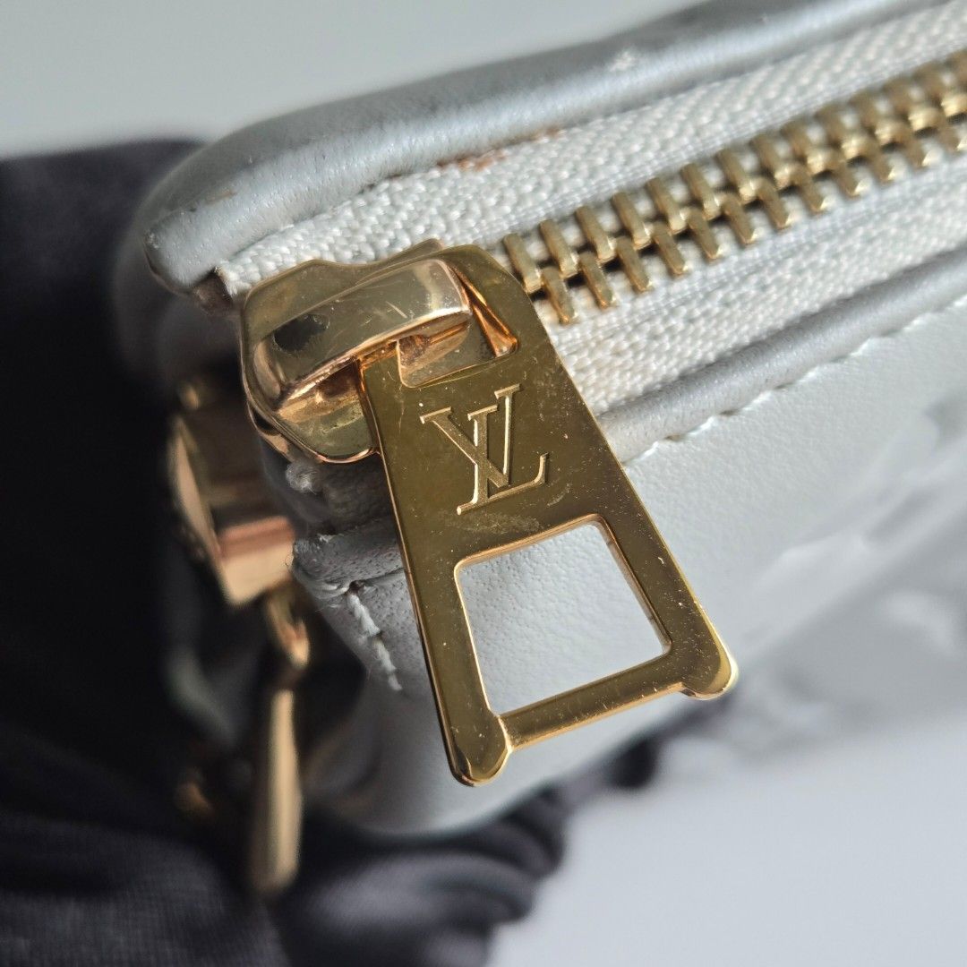 Lv Coussin (Category: Luxury Bags & Wallets) located in Paranaque City. Submitted by dclutterqueen (Listing ID 1453063166, Image 3). Description: Louis Vuitton Monogram Embossed Coussin 💯 Genuine leather in silver gray color 💢 Includes long leather strap, no chain strap (lost) 🇯🇵 Acquired preloved from Japan 👜 Measures approximately 8 x 6.5 inches.