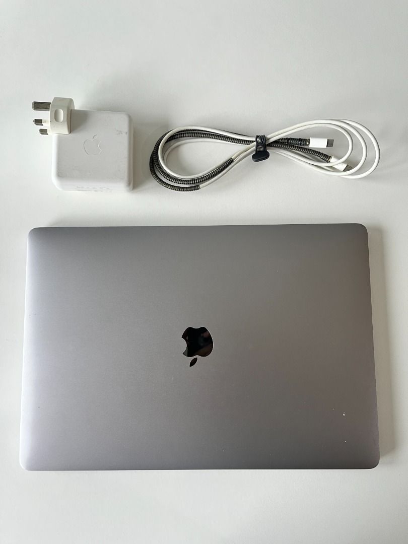 Macbook Pro 15” 2019 with 16GB RAM / 256 SSD / Intel Core i7 (Category: Laptops & Notebooks) located in Quezon City. Submitted by robbin123 (Listing ID 1453136243, Image 2). Description: - Camera not working - Battery replaced - Small scratches on the back - Peeled off rubber feet pad Includes the original Apple USB-C charging brick Can send more photos and videos RFS: upgrading Meetup: SM North EDSA, Trinoma/Vertis North Delivery: Shouldered by 