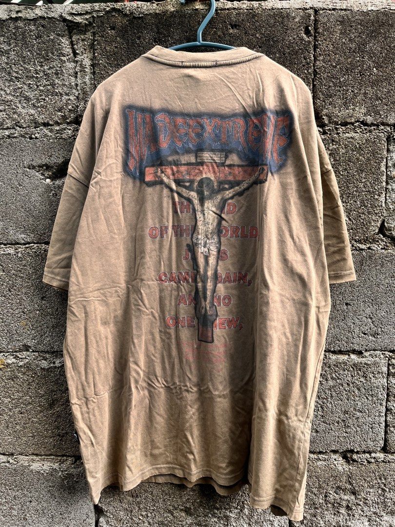 MADE EXTREME - JESUS TEE (Category: Tshirts & Polo Shirts ) located in Hinigaran. Submitted by err0n (Listing ID 1453073221, Image 2). Description: Vintage-style faded beige oversized T-shirt featuring a large back graphic with distressed “Made Extreme” text, a crucifix illustration, and religious-inspired typography. Made from soft cotton with a naturally worn and faded look, perfect for casual, grunge, or streetwear outfits. Pre-owned with visi