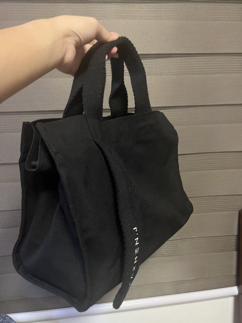 MARHEN.J Black Canvas Tote Bag (Category: Tote Bags) located in Plaridel. Submitted by rarefindlux (Listing ID 1453128235, Image 2). Description: - Classic black MARHEN.J canvas tote bag - Simple and functional design - Perfect for everyday use - Spacious interior for all your essentials - Inner pockets for easy organization - Made with durable material - Comfortable and easy to carry.