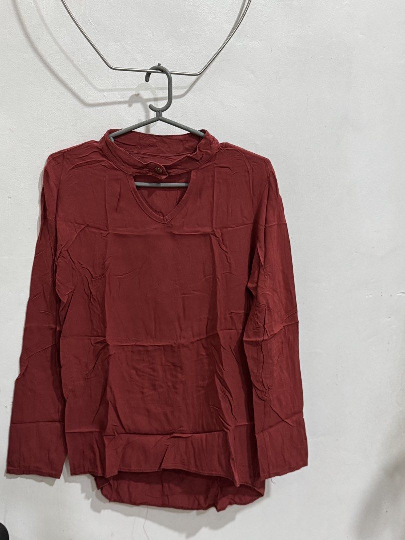 Maroon Long Sleeve Top with Cut-out Neckline (Category: Longsleeves) located in Manila. Submitted by acluttering (Listing ID 1453167080, Image 1). Description: - Chic maroon long-sleeved top - Features a stylish neckline cut-out with button closure - Textured, slightly crinkled fabric - Relaxed fit for ultimate comfort - Versatile for casual outfits, pairs well with jeans or skirts.