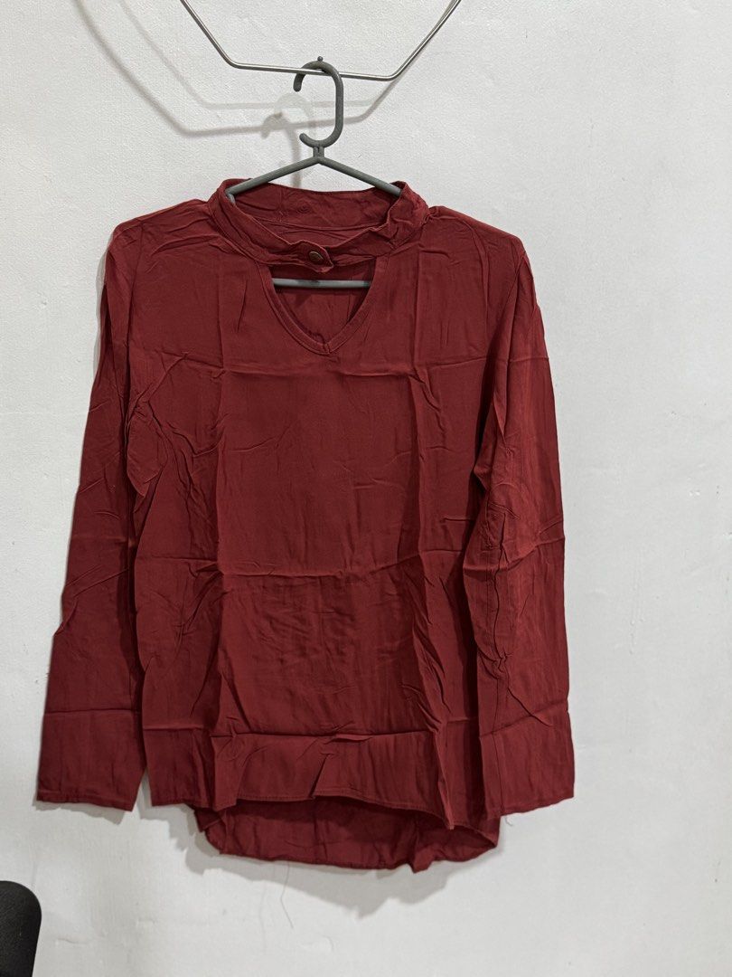 Maroon Long Sleeve Top with Cut-out Neckline (Category: Longsleeves) located in Manila. Submitted by acluttering (Listing ID 1453167080, Image 2). Description: - Chic maroon long-sleeved top - Features a stylish neckline cut-out with button closure - Textured, slightly crinkled fabric - Relaxed fit for ultimate comfort - Versatile for casual outfits, pairs well with jeans or skirts.