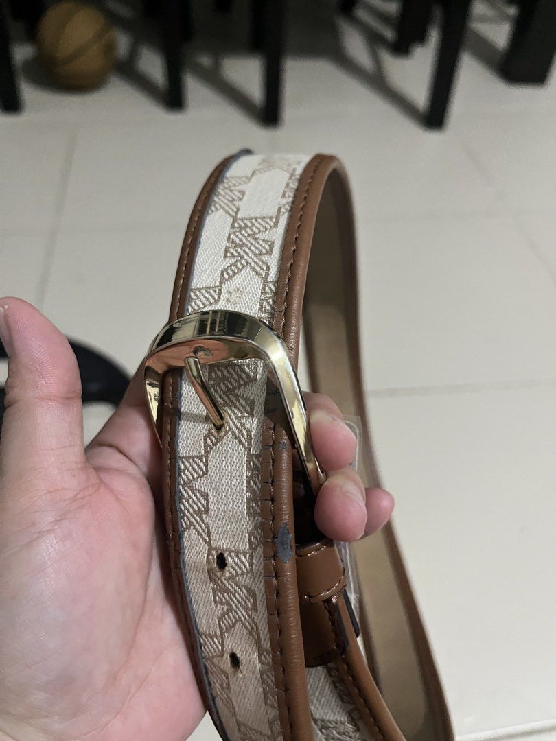 Michael Kors Belt - MK Monogram Canvas & Leather (Category: Belts) located in San Pablo. Submitted by celgvr (Listing ID 1453048125, Image 3). Description: - Authentic MK monogram belt - Classic brown and beige colorway - Elegant gold buckle - Genuine leather trim - Versatile accessory to elevate any outfit.
