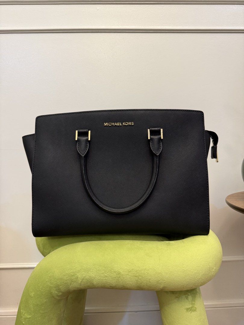 Michael Kors Black Leather Tote Bag (Category: Luxury Bags & Wallets) located in Pasig City. Submitted by affordablestuffph (Listing ID 1453109146, Image 1). Description: - Classic black Michael Kors tote bag - Genuine Saffiano leather - Elegant gold hardware details - Spacious interior, ideal for work or everyday use - Approximate width: 15 inches.