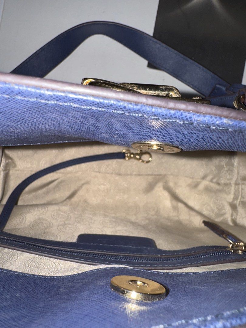 Michael Kors MK Navy Hamilton Medium Satchel Bag (Category: Luxury Bags & Wallets) located in Manila. Submitted by antonettegan (Listing ID 1453057409, Image 3). Description: - Navy blue Michael Kors handbag - Elegant gold hardware details - Removable chain strap for versatile styling - Interior features a zip pocket and a slip pocket - Ample space for all your essentials - Perfect for everyday wear or dressing up for special occasions.