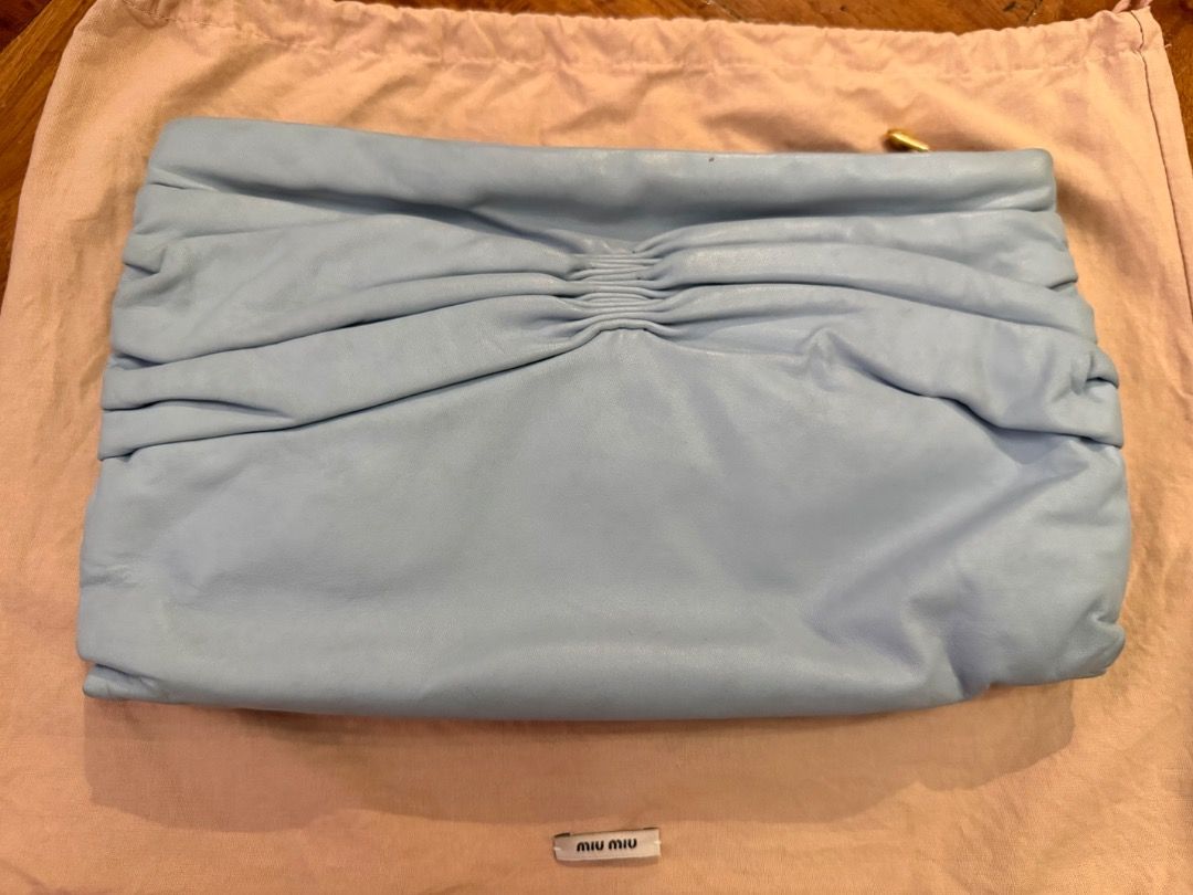 Miu Miu clutch (Category: Luxury Bags & Wallets) located in Quezon City. Submitted by bianxcloset (Listing ID 1453135960, Image 3). Description: Marks from storage .