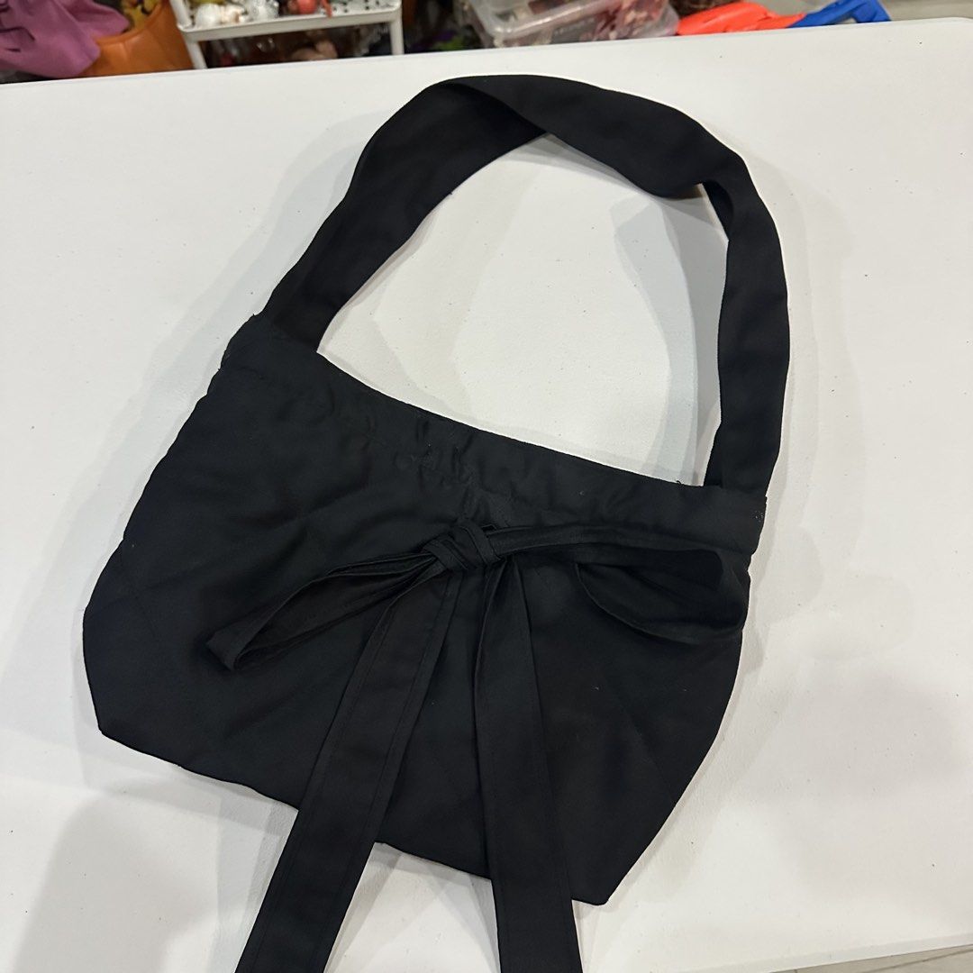Miu the Label on IG Ribbon Tote Bag (Category: Tote Bags) located in Bulacan. Submitted by notalyk (Listing ID 1453177359, Image 1). Description: - with freebie (2 items and up) 💗 📍Bulacan Delivery fee is shouldered by customer .