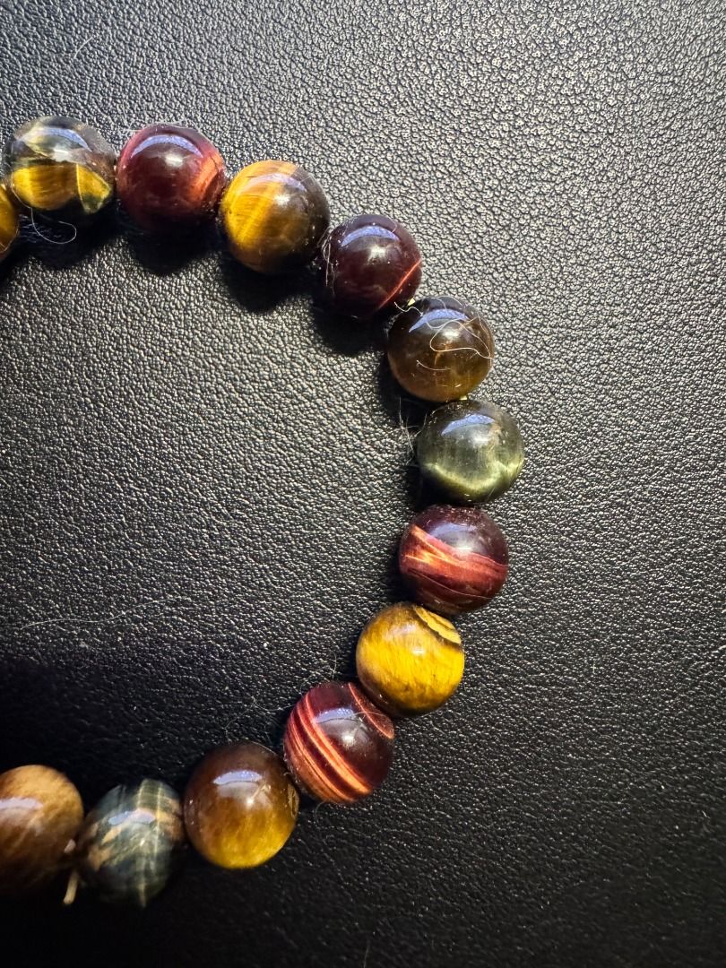 Multicolor Tiger's Eye Bracelet (Category: Bracelets) located in Makati City. Submitted by magsff (Listing ID 1453053767, Image 2). Description: * Bought during a trip to Phuket, Thailand * Combines Gold, Red, Blue Tiger's Eye * Stone of perception, perspective, and self-discipline * Promotes protection and good luck * Enhances confidence and motivation * Promotes calm communication.