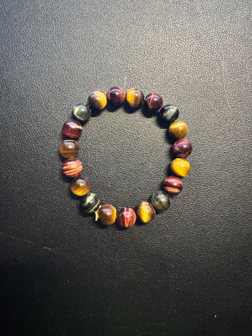 Multicolor Tiger's Eye Bracelet (Category: Bracelets) located in Makati City. Submitted by magsff (Listing ID 1453053767, Image 1). Description: * Bought during a trip to Phuket, Thailand * Combines Gold, Red, Blue Tiger's Eye * Stone of perception, perspective, and self-discipline * Promotes protection and good luck * Enhances confidence and motivation * Promotes calm communication.