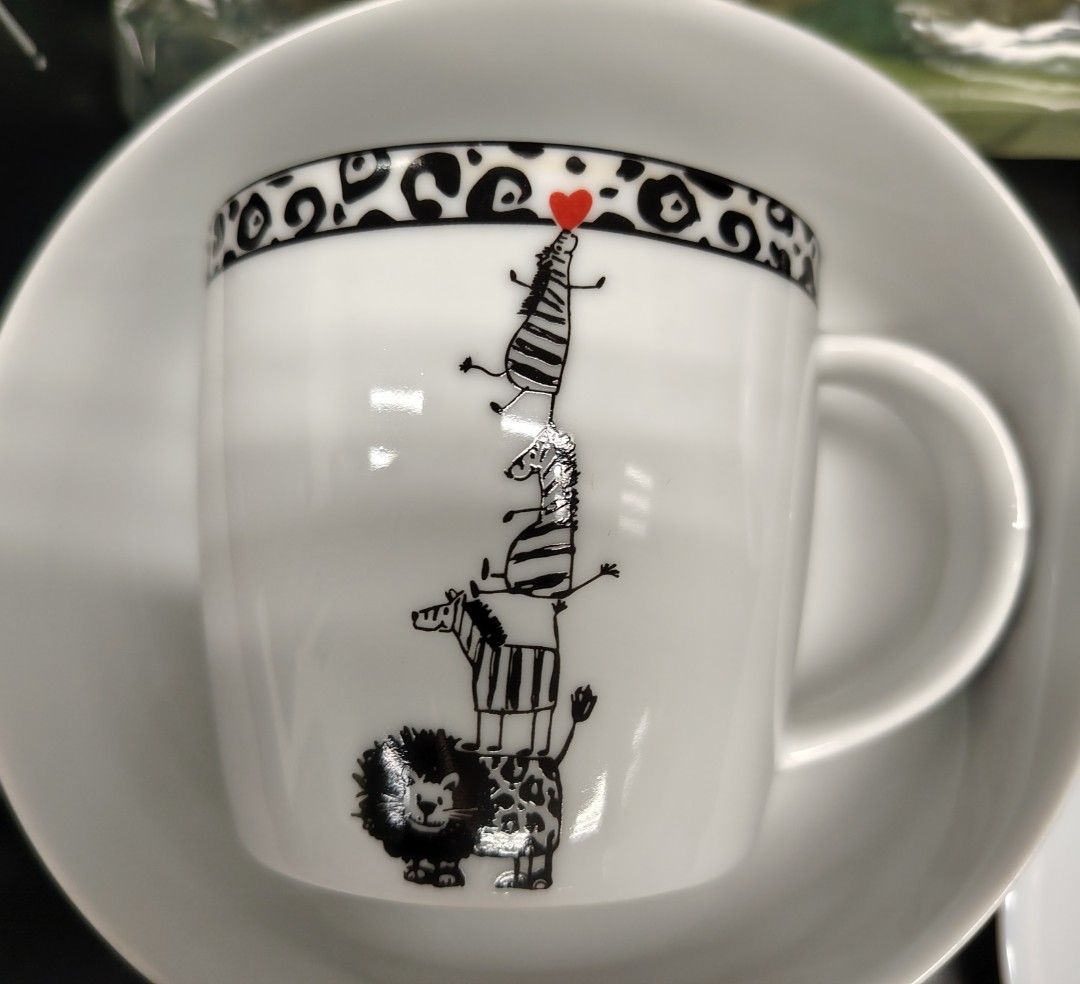 Multiple Choice Zebra Stack Mug (Category: Coffee & Tea Tableware) located in Singapore. Submitted by shop_bration (Listing ID 1453125339, Image 1). Description: - Cute mug featuring a stack of animals: zebras, giraffe, and lion. - Adorned with a little red heart on top. - Features a stylish black and white animal print on the rim. - Microwave and dishwasher safe for convenience. - Brand: Multiple Choice.