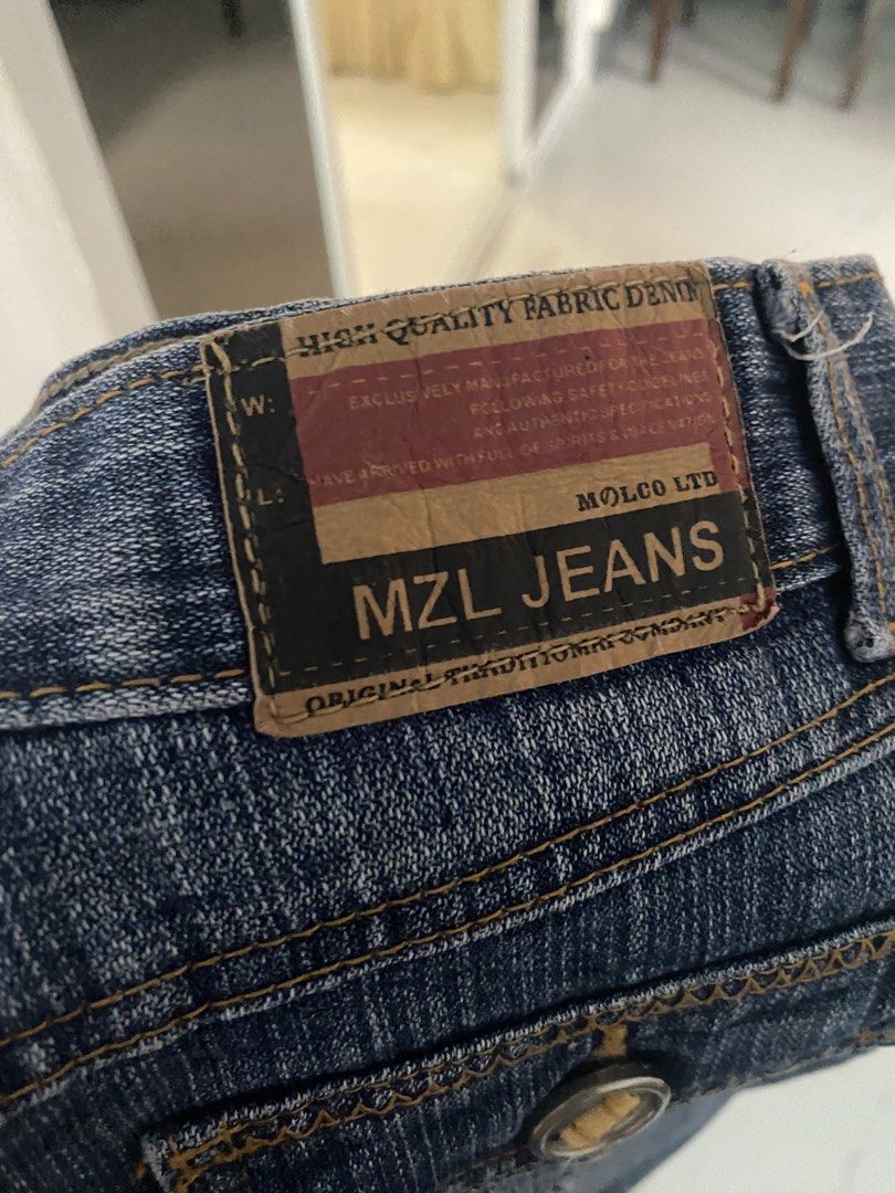 MZL Jeans Denim Mini Skirt (Category: Skirts) located in Batangas. Submitted by bmrlne (Listing ID 1453098122, Image 3). Description: - Brand: MZL Jeans - Style: Blue denim mini skirt - Features: Classic five-pocket design, zip fly - Wash: Distressed for a vintage look - Occasion: Great for casual wear - Versatility: Easy to pair with various tops.